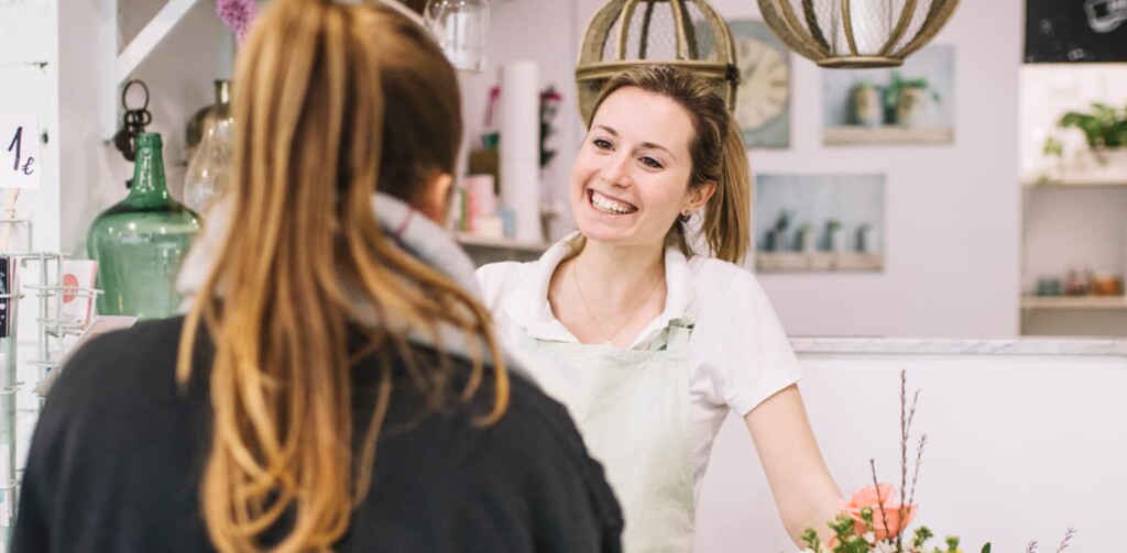 good customer service in retail header image florist smiling